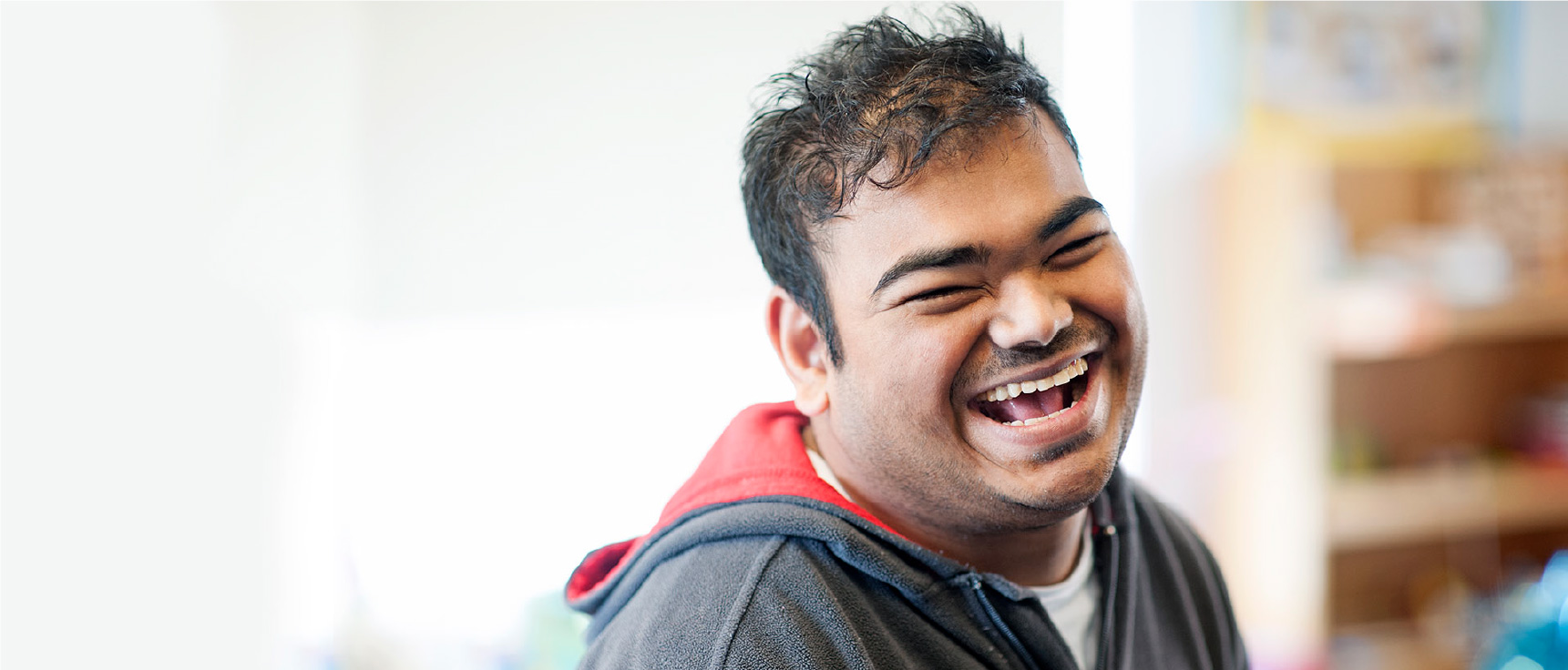 Young man smiling during rehabilitation class